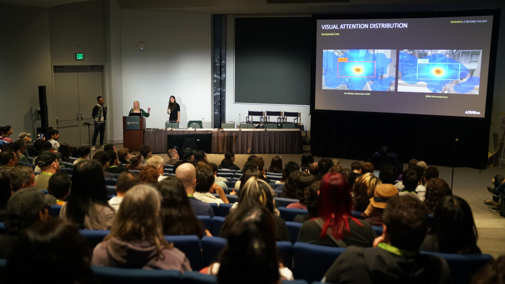 An almost full room of people attending Activision's conference on motion sickness reduction features.